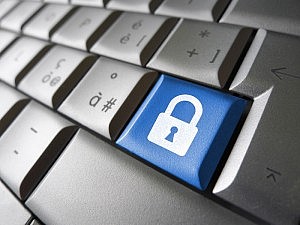 Internet, web and computer data security concept with padlock icon and symbol on a blue laptop key for website and online business.