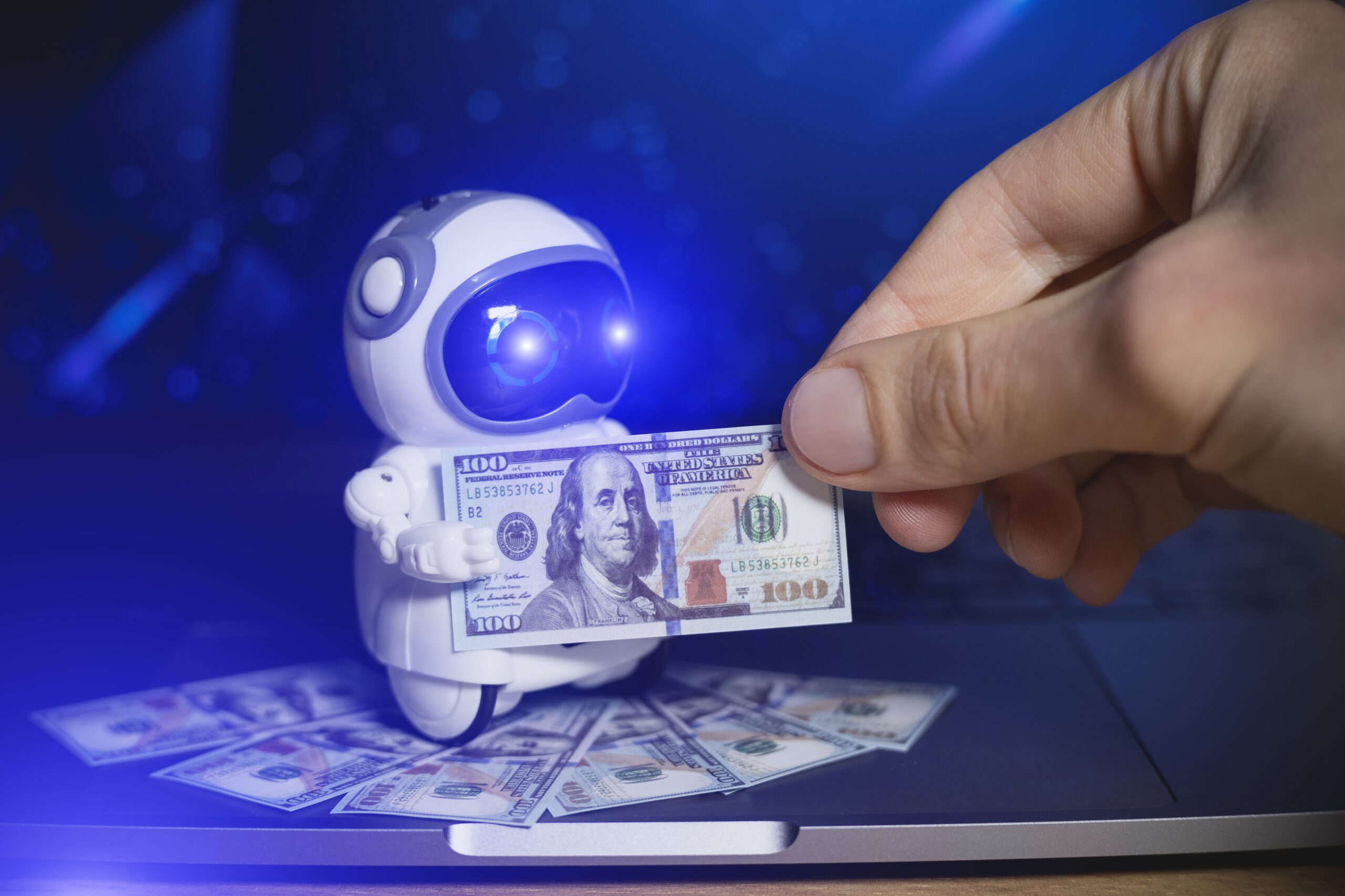 Real robot give dollars money for people. Salary concept. Modern digital technology concept. Artificial intelligence as an aid in making money. Business development.
